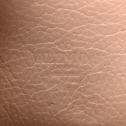 Valentino Garavani Pebbled Calfskin Medium Rockstud Flip Lock Crossbody Bag Skin Sorbet