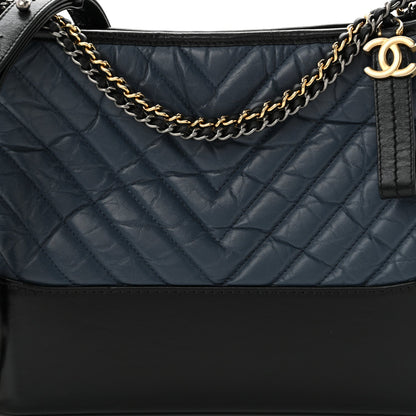 Chanel Aged Calfskin Chevron Quilted Medium Gabrielle Hobo Navy Black